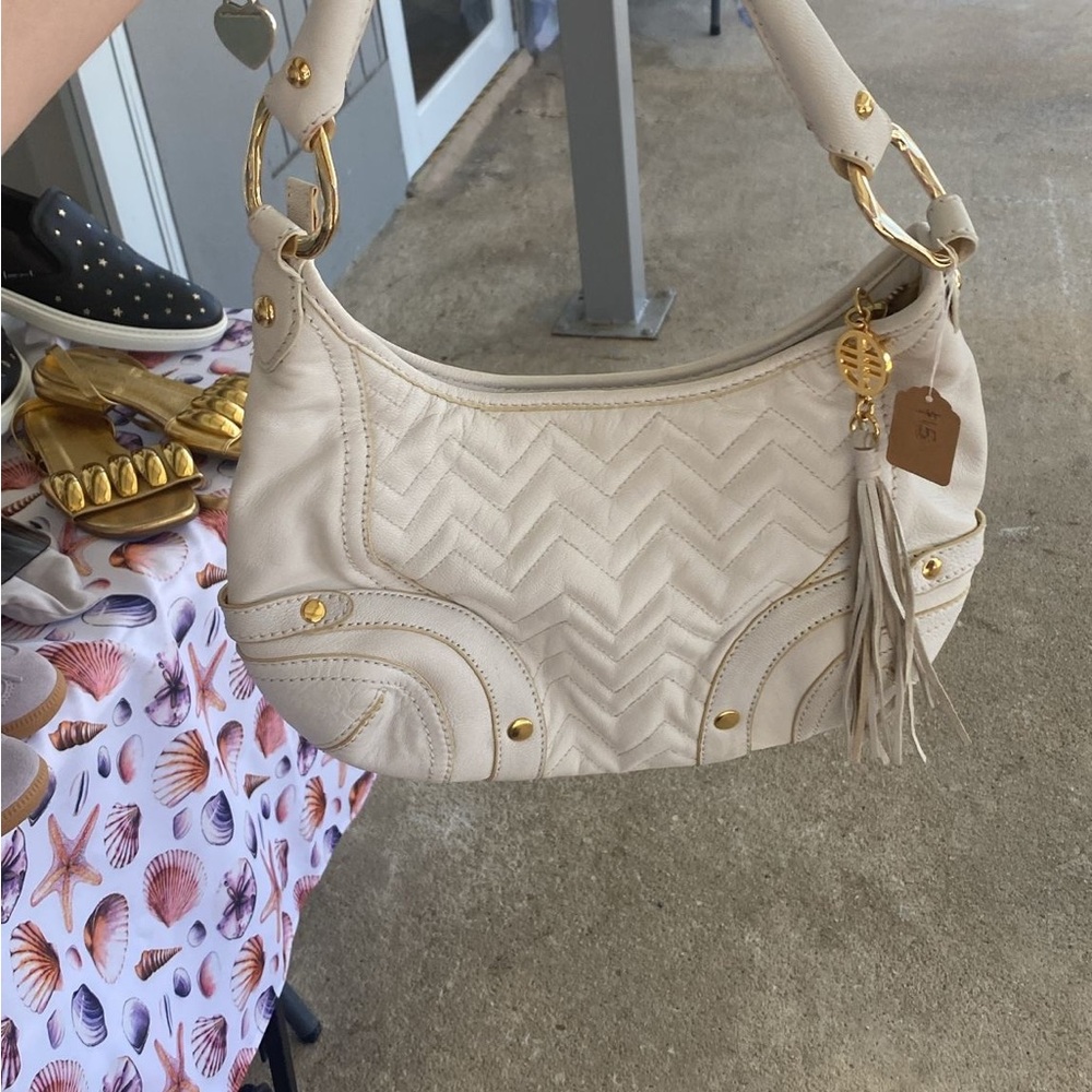 Elegant Cream Handbag with Gold Accents